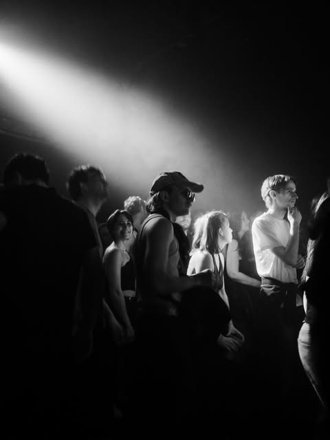 Guests dancing together in the light at UNITED.